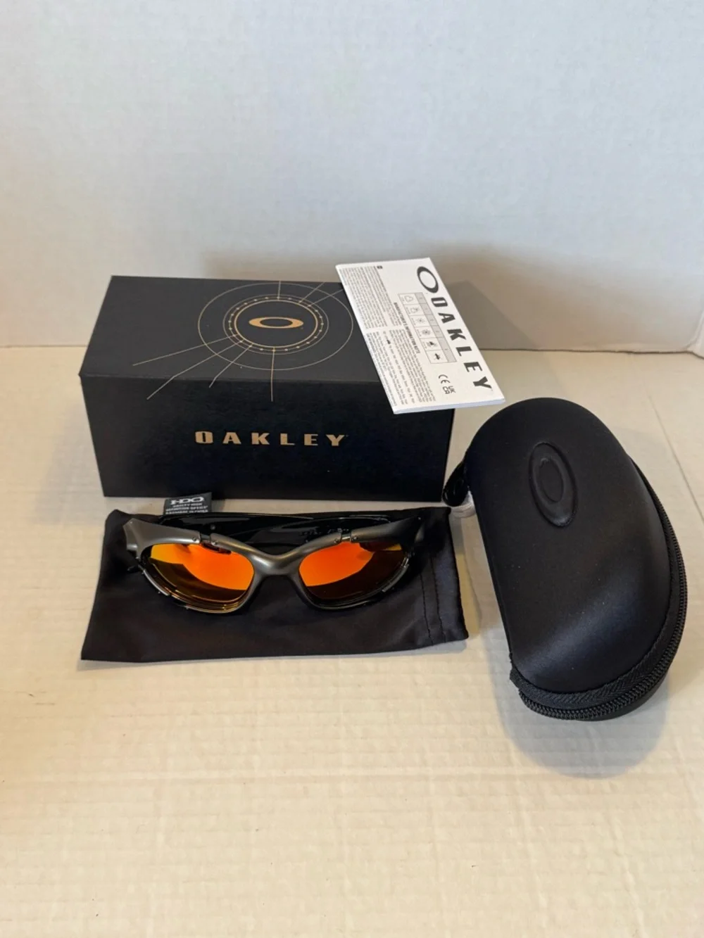 Oakley Black Sunglasses with Orange Mirror Lenses
